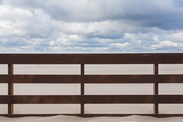 wooden fence in the sand on the beach