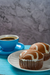 chocolate flavor cup cakes and cup of coffee