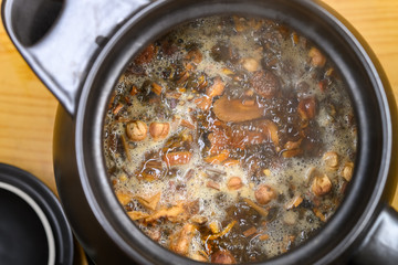 top view decocting Chinese medicinal herbs with enamel pot