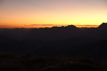 Sunrise above mountain range in the Alps