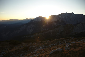 Sunrise above mountain range in the Alps