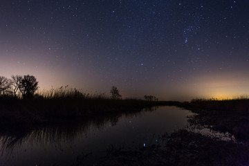 Night landscape and the starry sky
