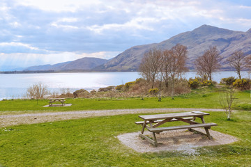 Outdoor picnic bench in a nice mountain area. Fort William. Highlands Scotland.