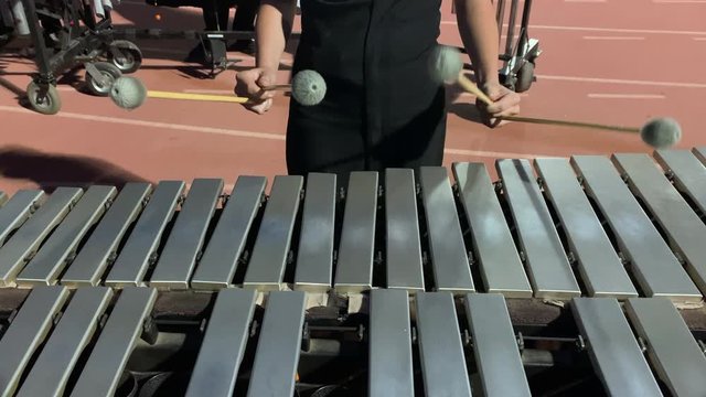 close up of person playing Xylophone or percussion instrument