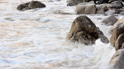 Waves beating against the rocks at Vidiago beach in Asturias