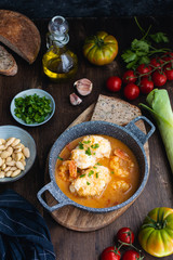 Mediterranean catalan cuisine ingredients, shrimps, raw monkfish, tomatoes, garlic, almonds, olive oil top view