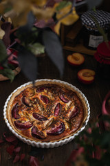 Homemade bakery, plum tart pie on wooden table