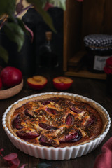 Homemade bakery, plum tart pie on wooden table