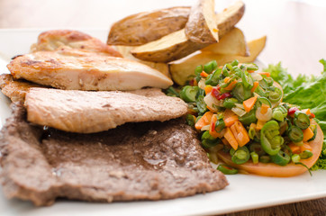 meat, chicken, beef and pork mix accompanied by vegetables