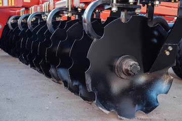 Working parts of new modern agricultural disc harrow for tillage