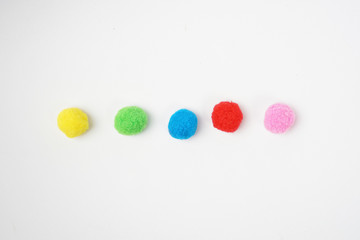 Colorful cotton balls for Montessori called Pom pom ball - Isolated white background