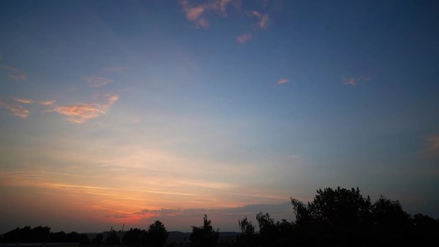 Time lapse of sunrise sky with clouds