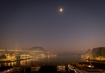 Sydney Harbour clocked by bush fire smoke at dawn