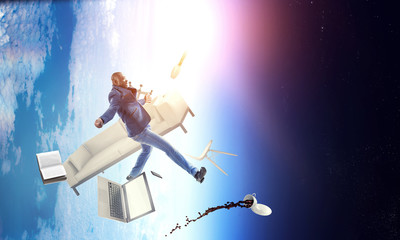 Businessman jumping in gravity. Mixed media