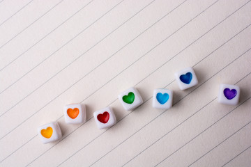 Colorful cubes with a heart  on paper