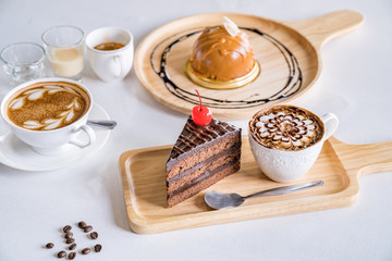 coffee cup, coffee beans and chocolate dessert isolated on white