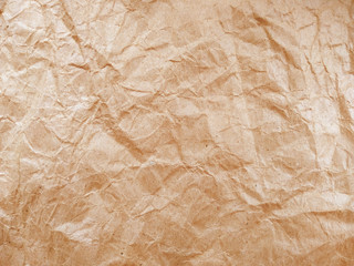 Crumpled paper ball isolated on white background. Crumpled paper texture. Brown crumpled paper texture for background.