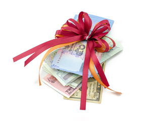 Gifts that are banknotes wrapped in a bow on white background