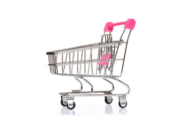 A empty miniature metal chrome trolley from a supermarket isolated on white background with clipping path..