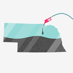 Map Nebraska, in USA, being fueled by oil. Gas pump fueled map. On the map there is glass reflection. American state. Conceptual. Oil producing or importing regions.