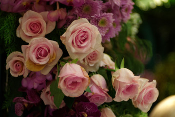 Pink rose bouquet with colorful bubble blur background	