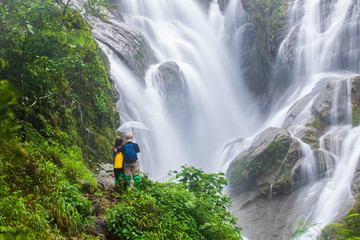 The lover  hiking  on Pi-tu-gro waterfall, Beautiful waterfall in Tak  province, ThaiLand.