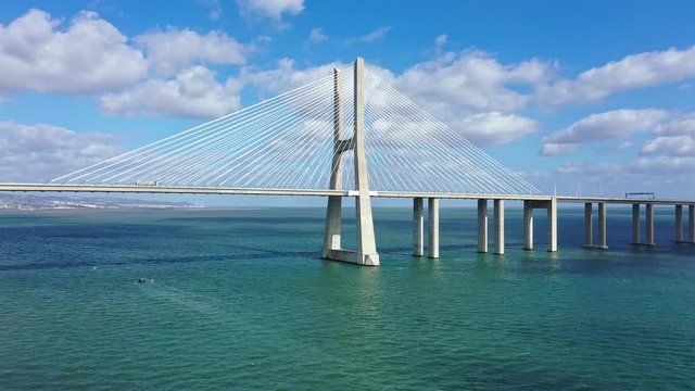 Aerial view over Vasco Da Gama Bridge in Lisbon - aerial drone footage