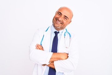 Middle age doctor man wearing stethoscope and tie standing over isolated white background happy face smiling with crossed arms looking at the camera. Positive person.