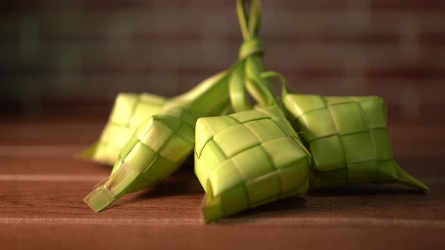 Ketupat (rice dumpling) is a local delicacy during the festive season in South East Asia, especially during eid fitri. It is a natural rice casing made from young coconut leaves, Selective Focus