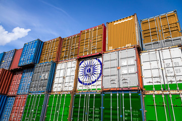 The national flag of India on a large number of metal containers for storing goods stacked in rows...
