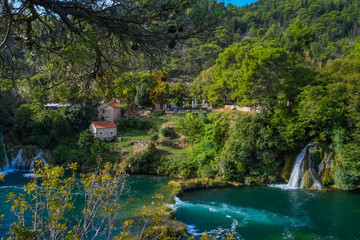 View of waterfalls, lakes, and old mill buildings in Krka National Park, Croatia
