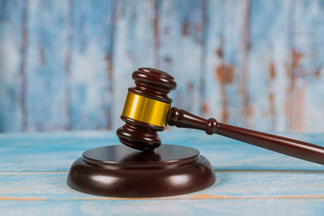 Wooden judge gavel on wooden background.