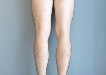 Closeup back of legs men skin and hairy for health care concept with grey background