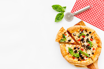 Homemade pizza on white background top view copy space