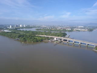 Kuching, Sarawak / Malaysia - November 19 2019: The Kuching Barrage Structure underneath the Bridge along Sarawak River