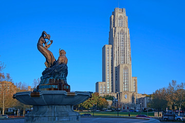 University of Pittsburgh's Cathedral of Learning skyscraper and  Schenley Park Memorial Fountain dating from 1889. - 303746856