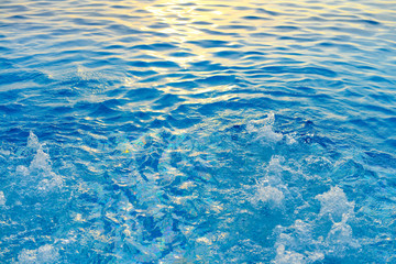 Fountain in Swimming pool and sunlight refraction