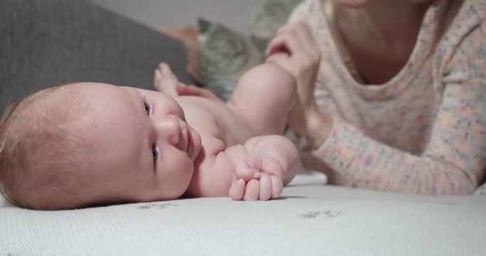 Mother communicates with her little baby girl.