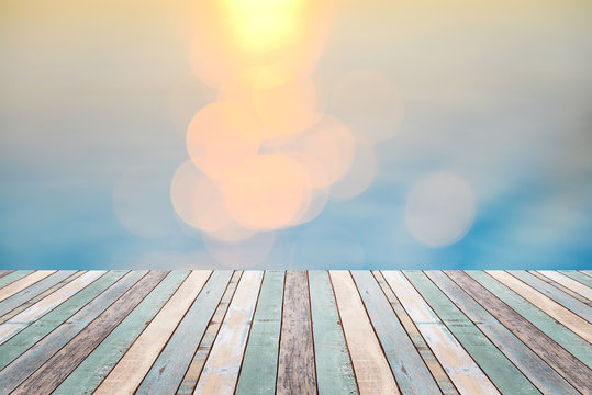 Wood table top on golden bokeh abstract background