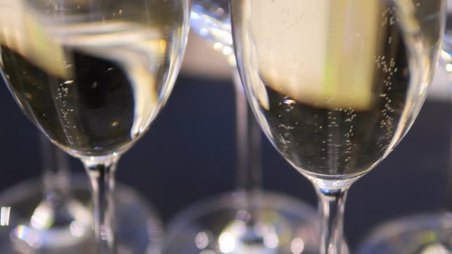 Close up, champagne in wine glasses. a sparkling wine with bubbles.