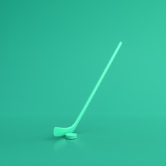 Green sport equipment hokey stick and puck on green background, solid background, flat background, single color, 3d Rendering