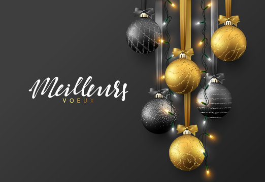 Meillieurs voeux Joyeux Noel. Christmas greeting card, design of xmas ball black and gold with realistic garlands on dark background.