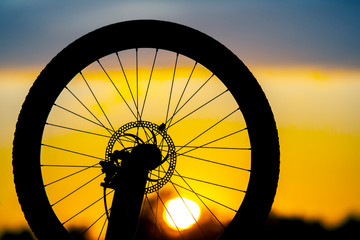 bicycle silhouette on sunset background