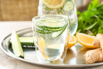 Glass of healthy infused water on tray