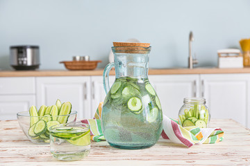 Healthy infused water on table in kitchen