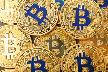 Many bitcoins as background, top view