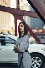 young lady crossing the bridge while exploring chicago