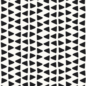 Black and white hand drawn triangle seamless vector pattern. A fun abstract geometric repeat design background.