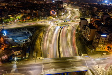 Fototapeta na wymiar Beautiful night traffic junction road with lights of vehicle movement aerial view from drone
