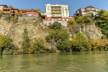 Fototapeta na wymiar Kura River, Tbilisi city view from boat ride on the Kura River